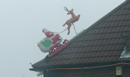 Santa caught on my grandma's neghbour's roof